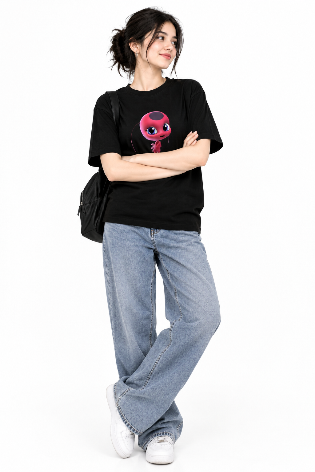 A classic black crewneck graphic t-shirt featuring Tikki, the Ladybug Kwami from Miraculous: Tales of Ladybug & Cat Noir.